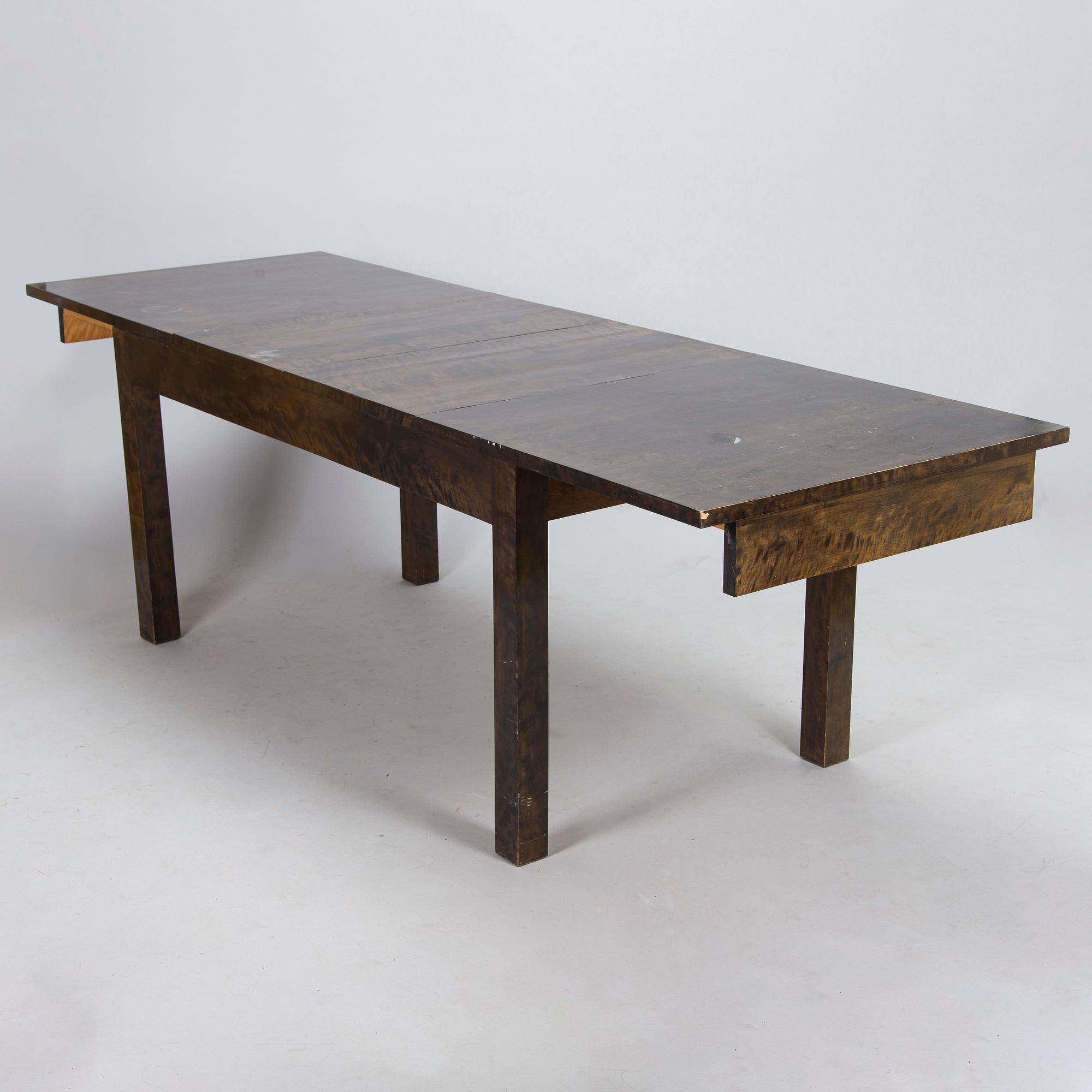 A Finnish 1930s dining table and eight chairs.