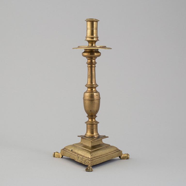 A 17th century bronze candlestick.