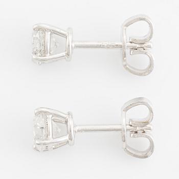 Earrings, single stone earrings with brilliant-cut diamonds.