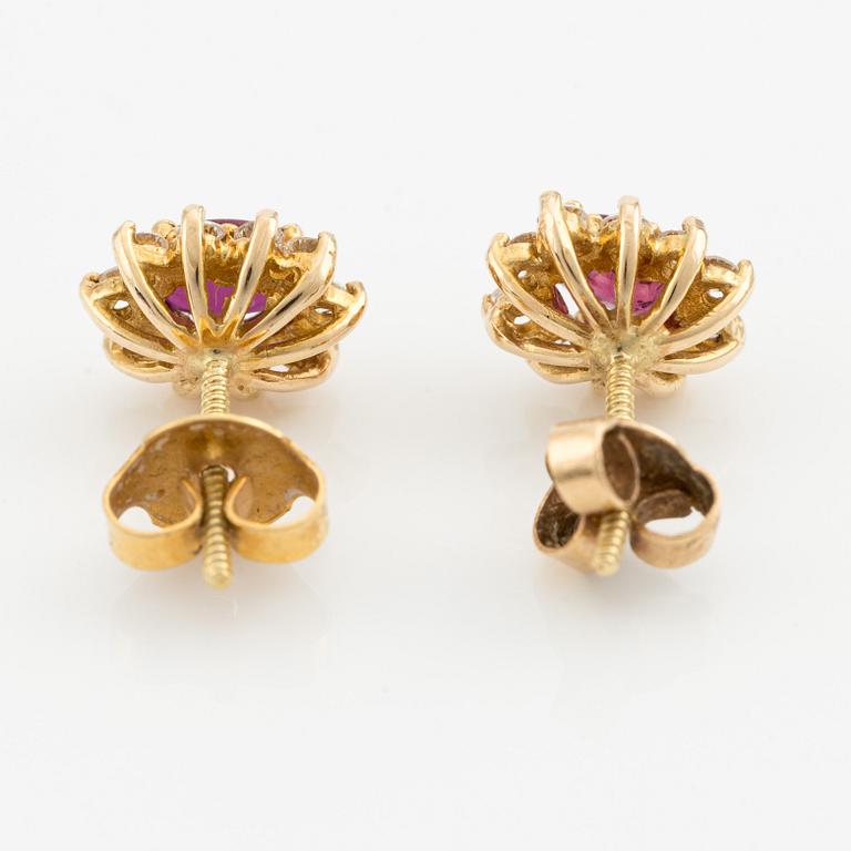 Earrings, a pair in carmosé style, with rubies and brilliant-cut diamonds.