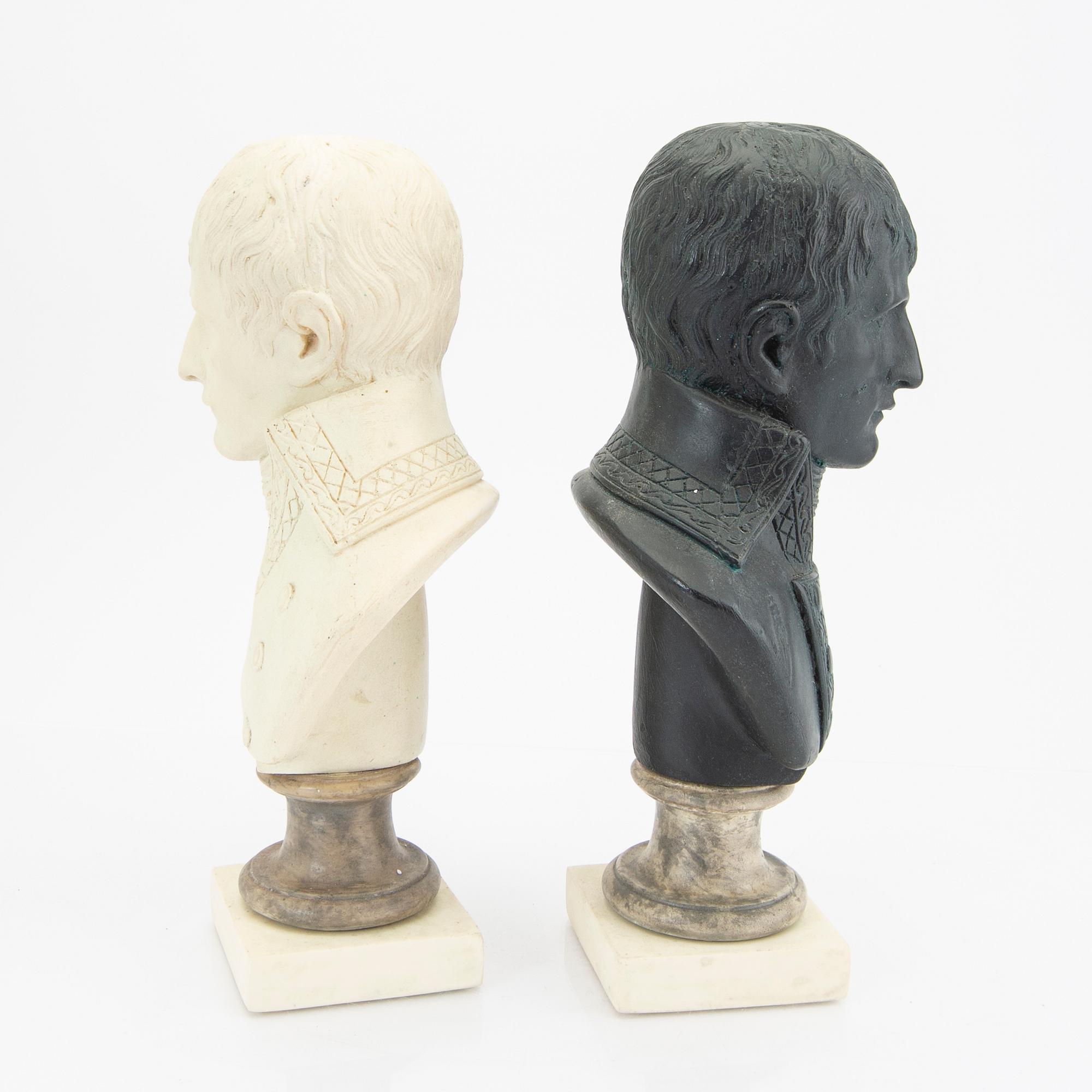 A pair of modern plaster statues of Napoleon.