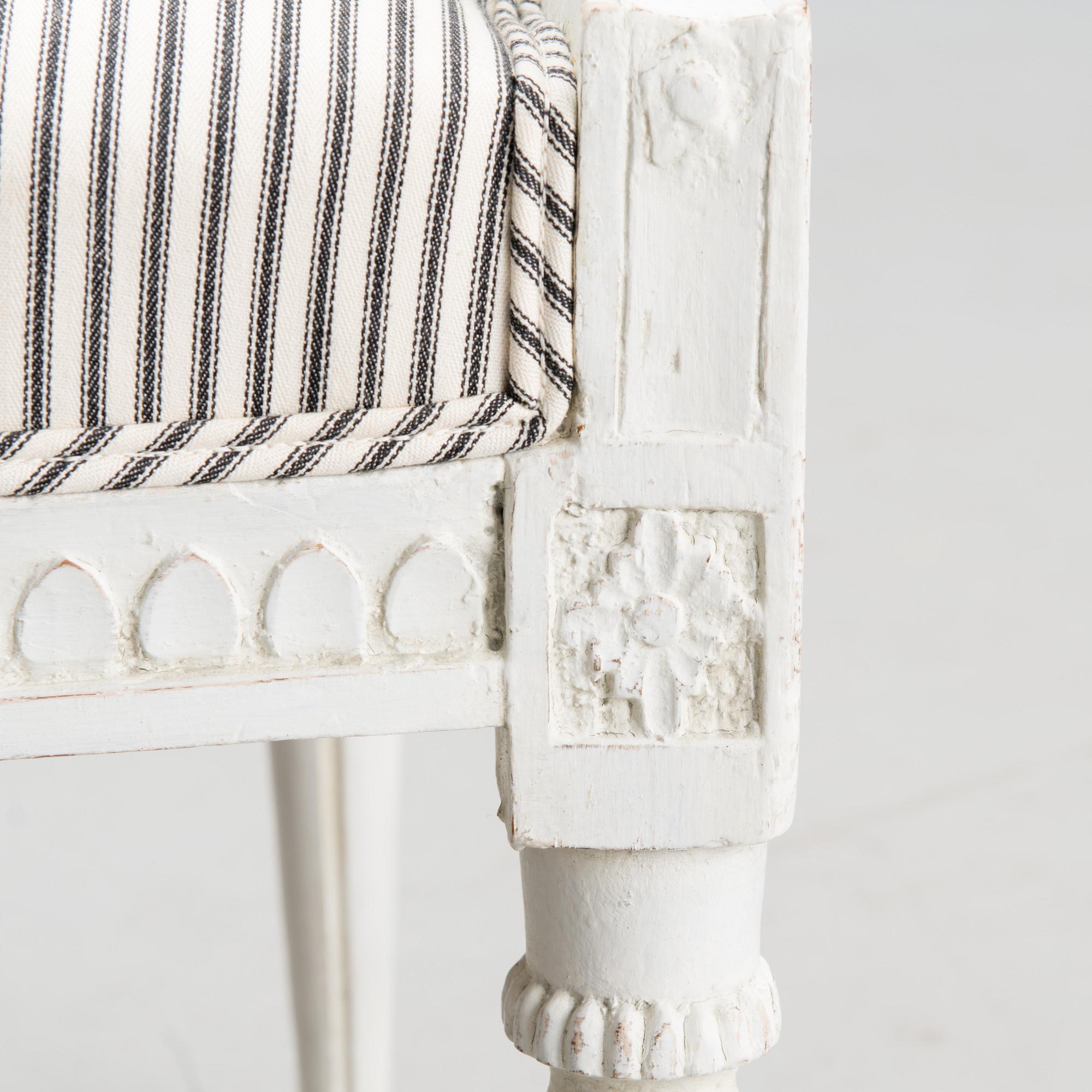 A late 18th century Swedidh Gustavian open arm chair.