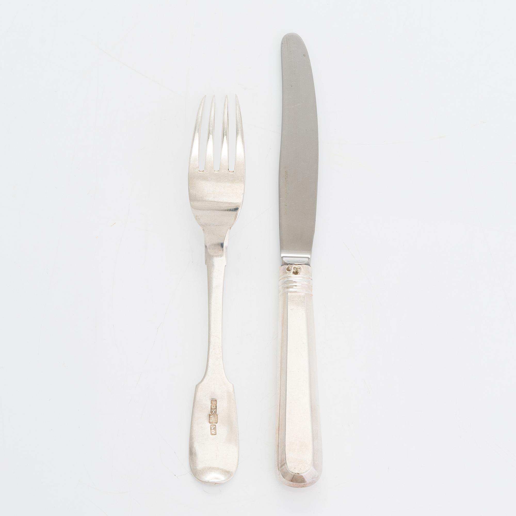 A 24-piece set of silver cutlery, Saint Petersburg 1870. Maker's mark A.K.