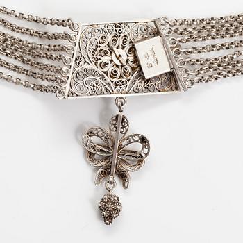 A silver necklace.