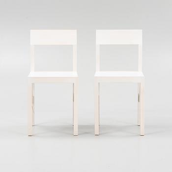 A pair of signed white stained pine chairs by Frederik Gustav for Frame, Copenhagen, 2023.