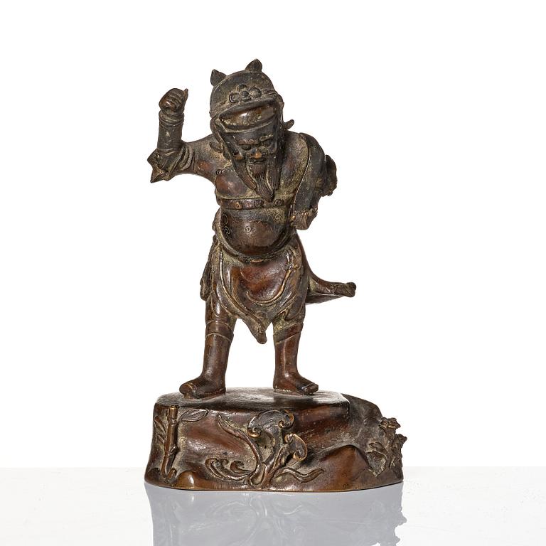 A bronze sculpture of a man with a tablet, Ming dynasty (1368-1644).