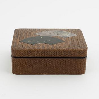 A Japanese woven bamboo box with metal inlaid shibuichi top, presumably Meji period (1868-1912).