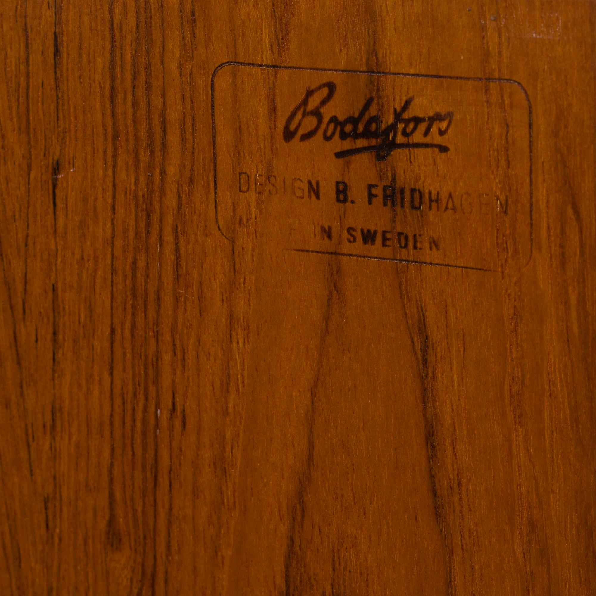 A second half of the 20th century teak veneered sideboard by Bertil Fridhagen, Bodafors, Sweden.