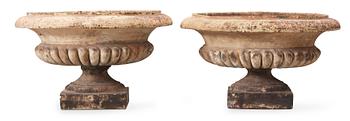 A pair of English 19th century stoneware garden urns.