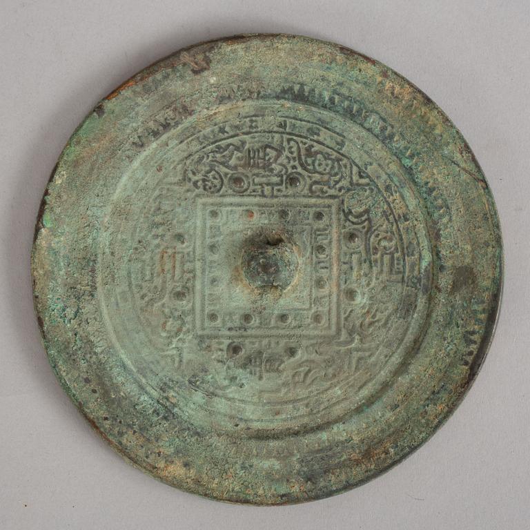 A bronze mirror, Xin-Eastern Han dynasty (9-220).