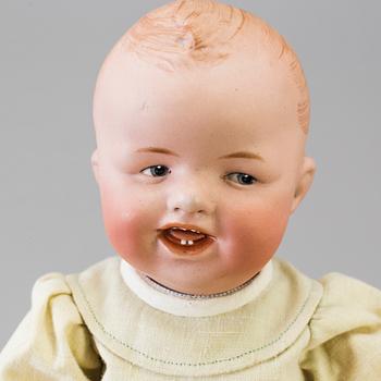 A bisque headed boy doll by Heubach, Germany, 1910s.