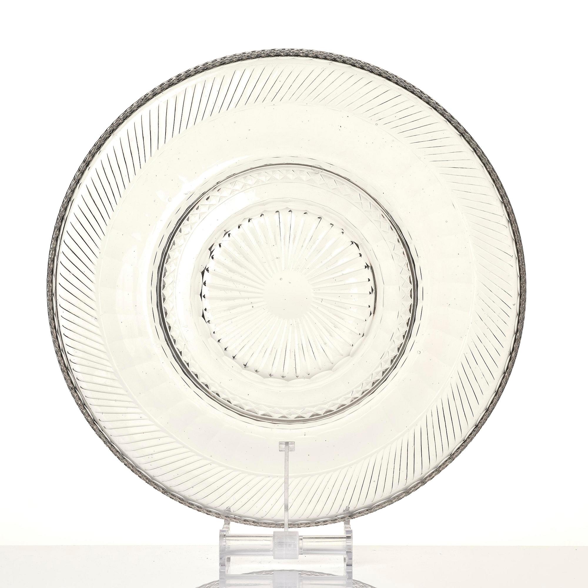 A cut glass punch bowl with cover, stand and ladle, Empire, first part of the 19th century.