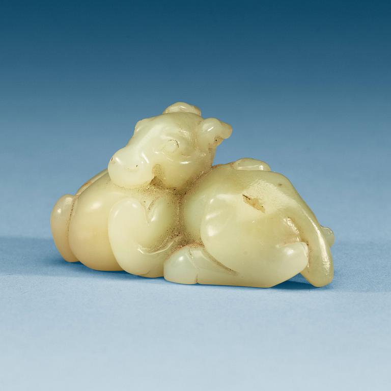 A Chinese nephrite figure of a reclining horse.