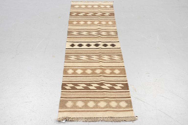 A runner, kilim, ca 240 x 62 cm.