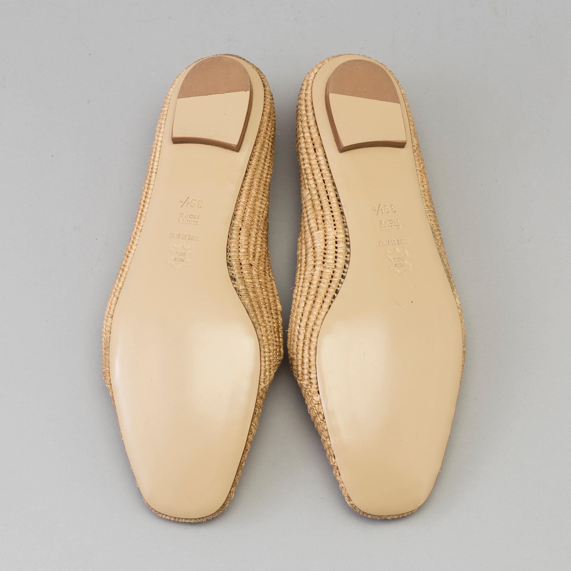 A pair of raffia shoes by Emma Hope's.