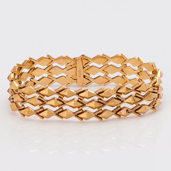 A 14K gold bracelet.