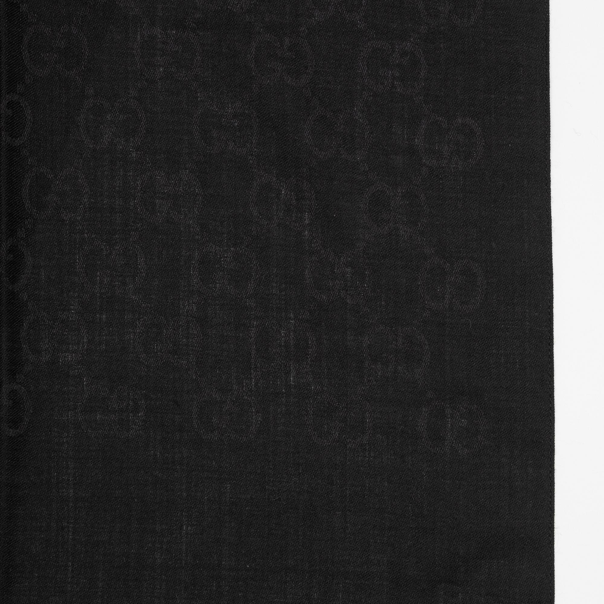 Gucci, a wool and silk mix "GG" jaquard shawl.