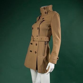 A TRENCHCOAT by BURBERRY.