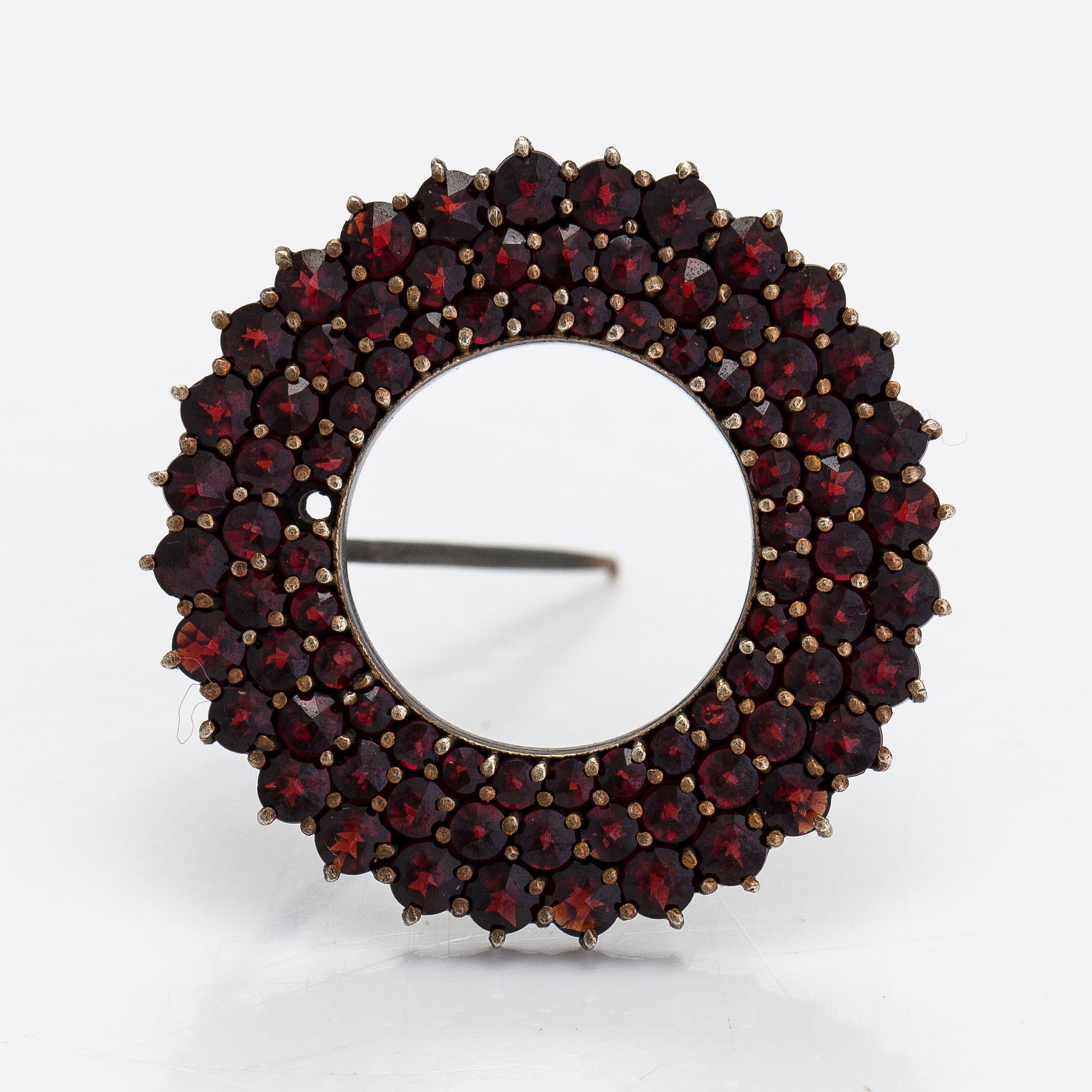 A necklace, brooch and earrings, gilded silver and garnets.