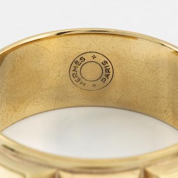 Hermès, a vintage gold tone stud bangle.