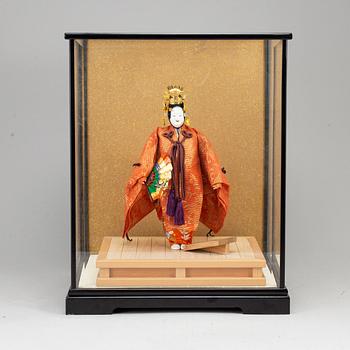 A Japanese doll from the 20th century.
