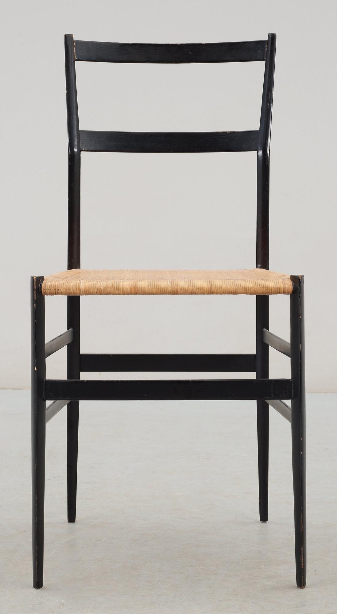 A Gio Ponti 'Superleggera' chair, Cassina, Italy, black painted ash with ratten seat.