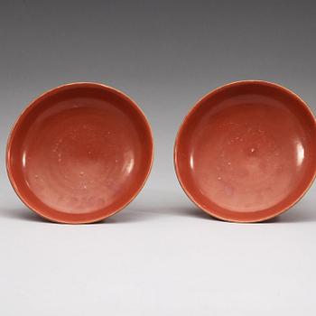 A pair of red glazed tazzas, Qing dynasty with Qianlong sealmark in underglaze blue.