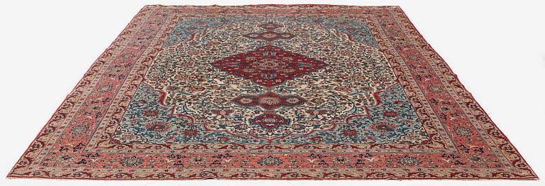 A semi-antique Qum carpet. Central Persia, c. 345 x 258 cm.
