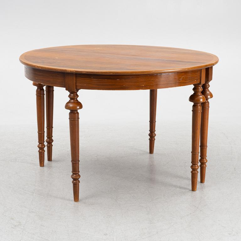 A dining table, circa 1900.