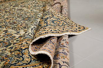 A Keshan rug, signed, ca 370 x 268 cm.