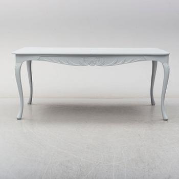 A rococo style dining table and six chairs, end of 20th century.