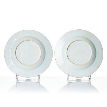 A pair of iron red decorated armorial dishes, Qing dynasty, 18th century.