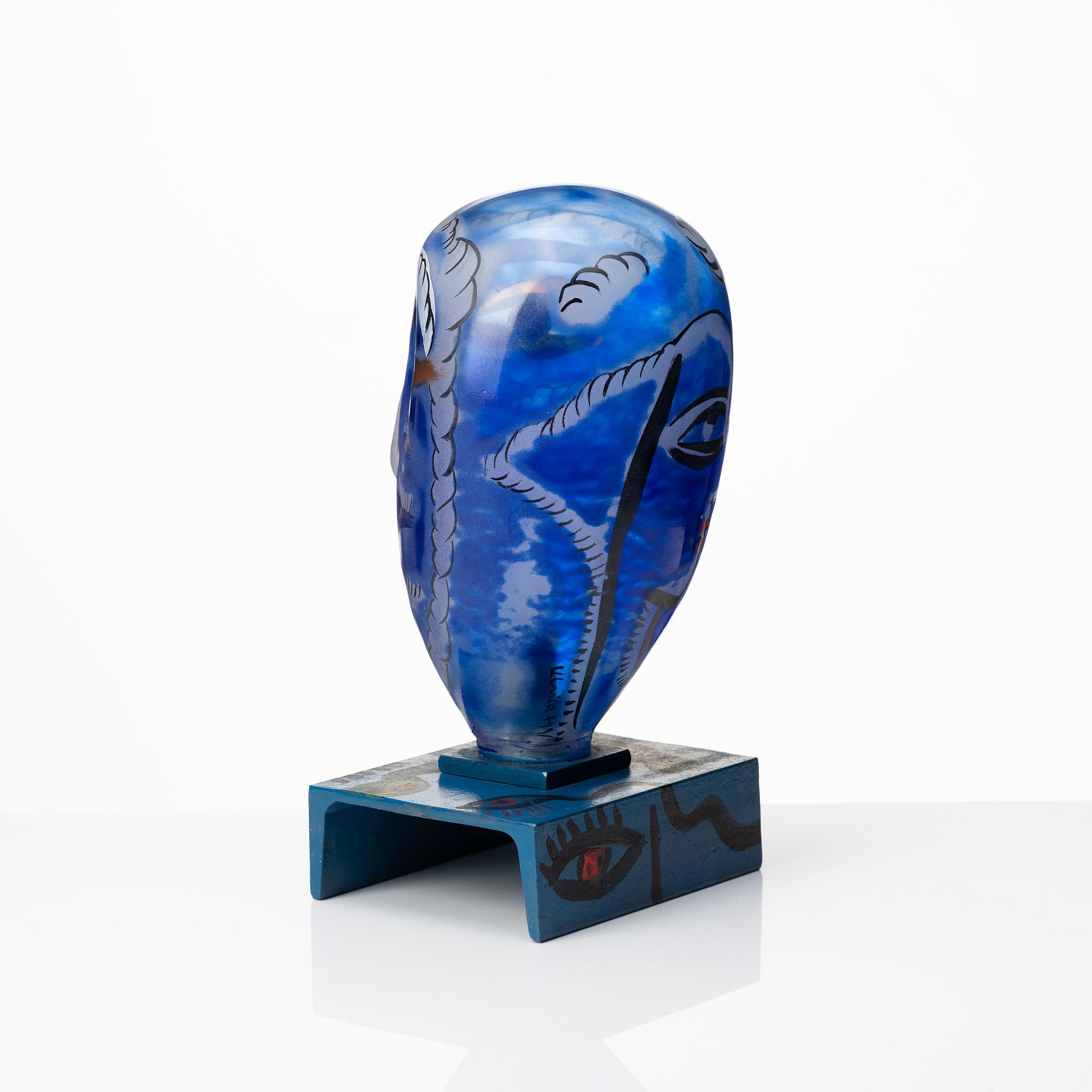 Ulrica Hydman-Vallien, a painted glass and iron sculpture of a face, Sweden.