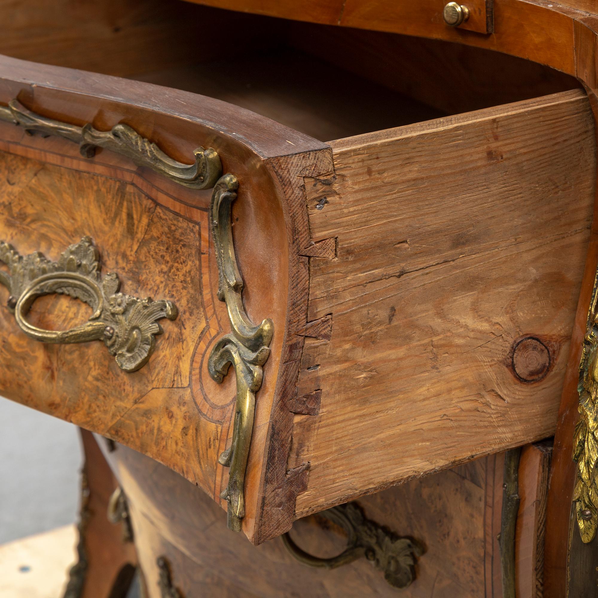 A 19th century rococo style secretaire.