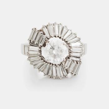 420. A Boucheron platinum ring set with a round brilliant-cut diamond weight ca 1.25 cts quality ca H vvs.