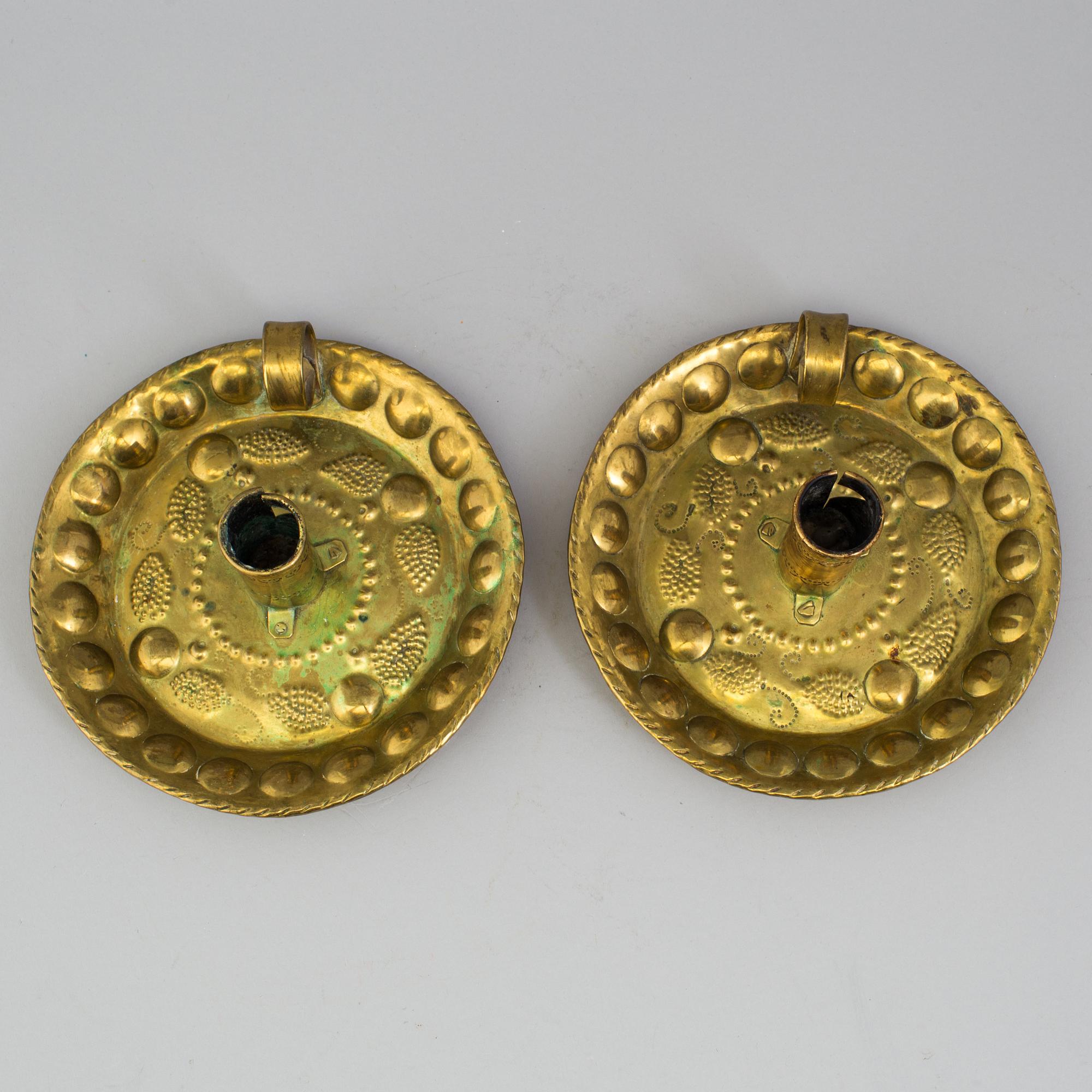 A pair of brass baroque style candlesticks.