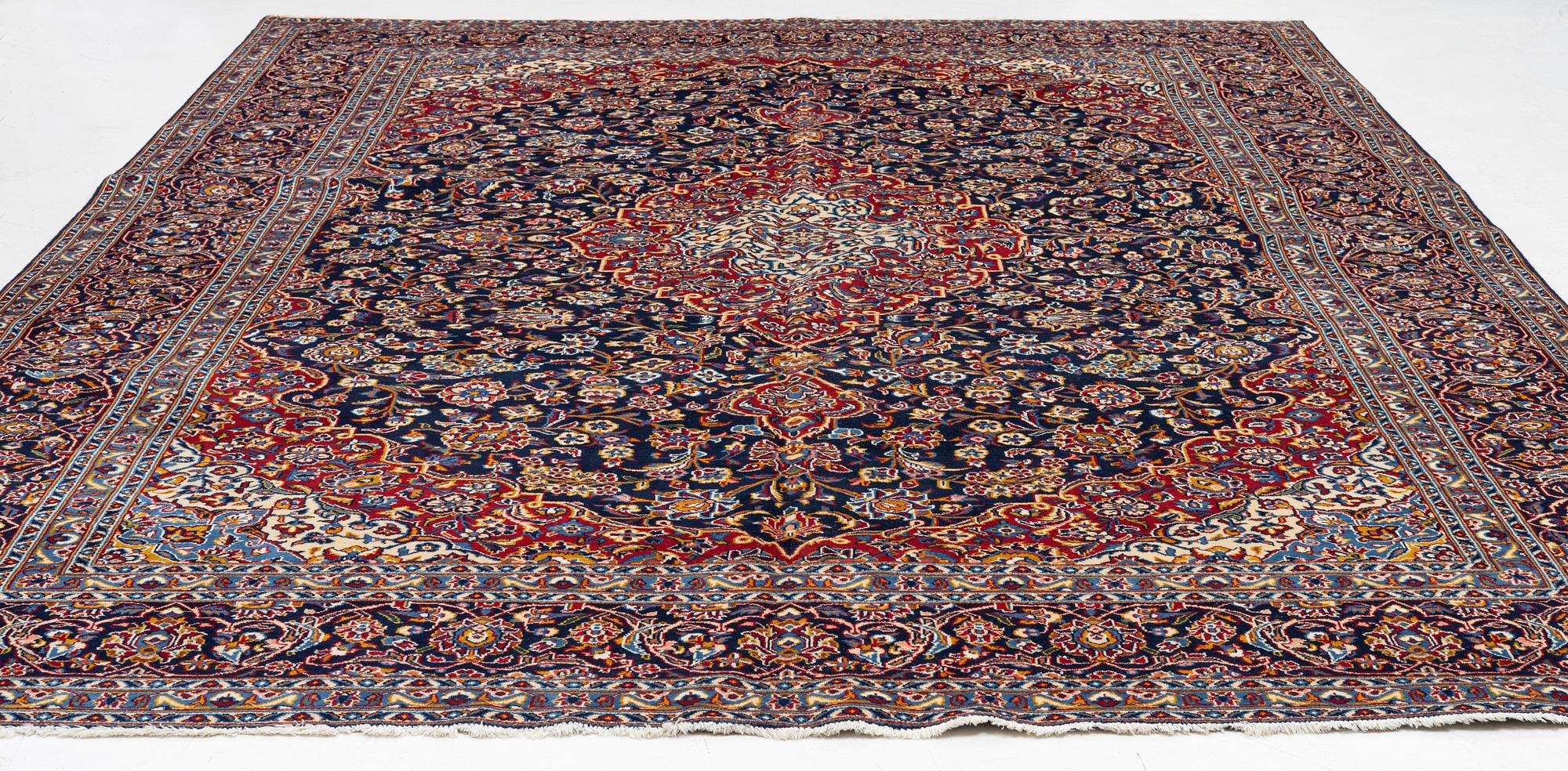 A Keshan carpet, c. 400 x 290 cm.