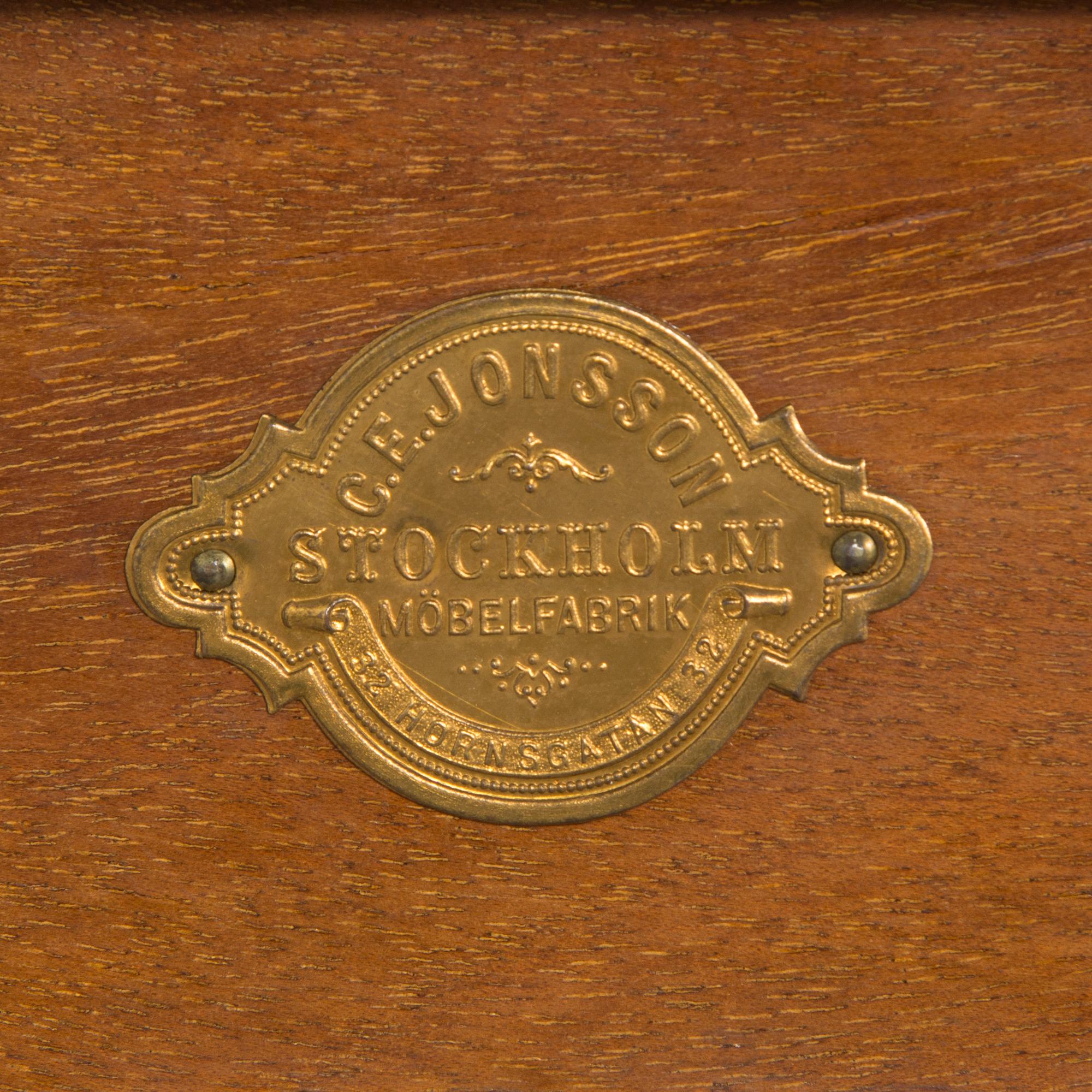 A mahogany console table with green stone top, C.E. Jonsson Möbelfabrik in Stockholm, early 20th century.