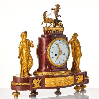 A French Empire 19th century gilt bronze mantel clock signed Lamiral.