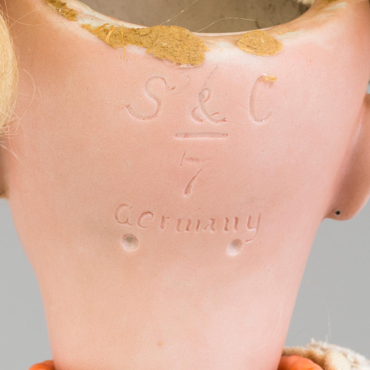 a Franz Schmidt & Co porcellain doll from the early 20th century.