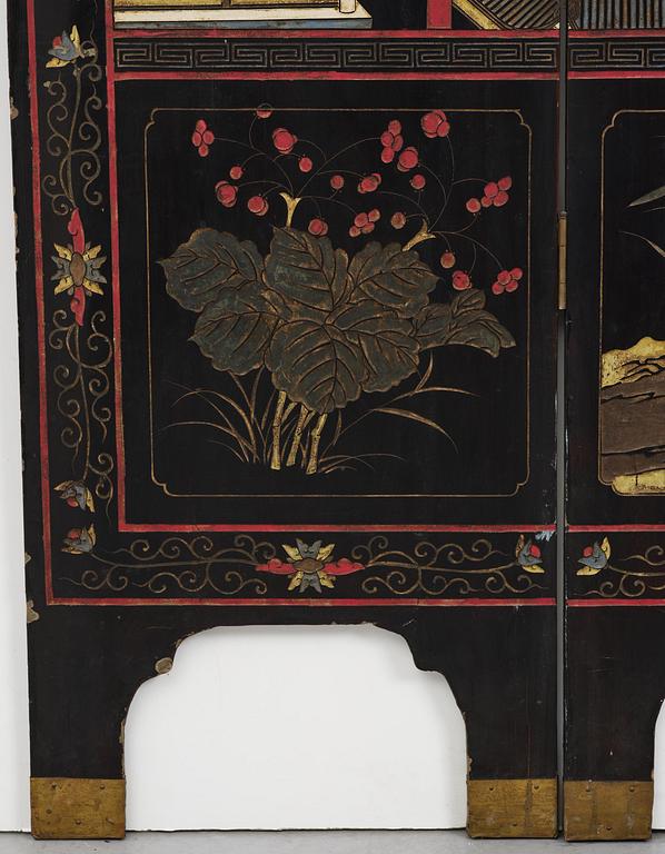 A Chinese four panel lacquer folding screen, first part of the 20th century.