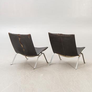 A pair of Poul Kjaerholm metal and leather PK22 easy chairs from Kold Christensen Denmark.