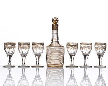 A set of six Russian glass goblets and a bottle with stopper, 19th Century.