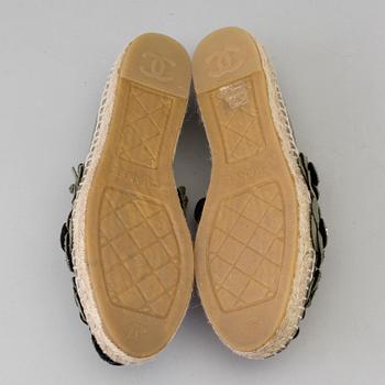 A pair of espadrilles from Chanel.
