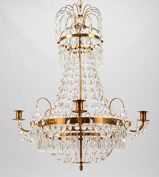 A Gustavian style chandelier from the first half of the 20th century. Height 67 cm.