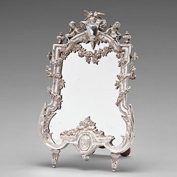 228. A French 19th century silver table-mirror. Louis XVI's style.