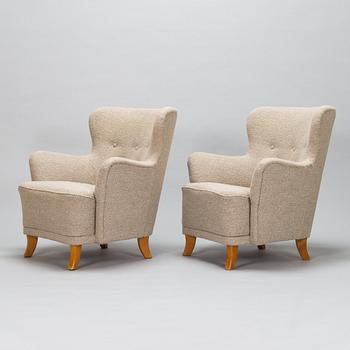 A pair of 1950s armchairs.