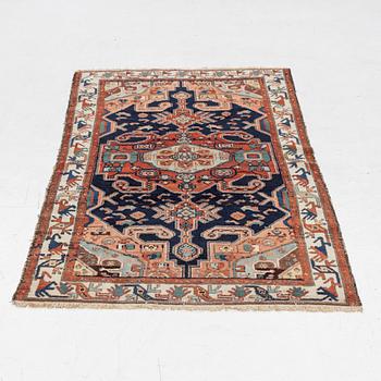 A Heriz rug, c. 192 x 133-139 cm.