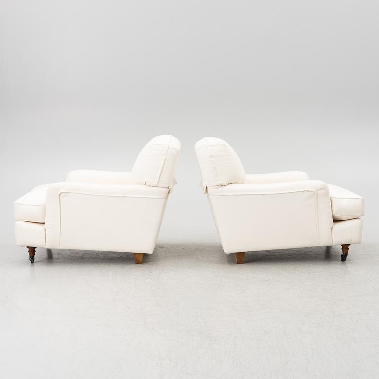 Vico Magistretti, a pair of 'Raffles' armchairs, De Padova, Italy, 21st century.