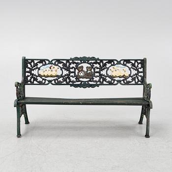 A children's cast iron garden sofa and armchair, mid 20th century.